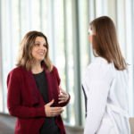 Melissa speaks with a nurse at the Ivy Brain Tumor Center