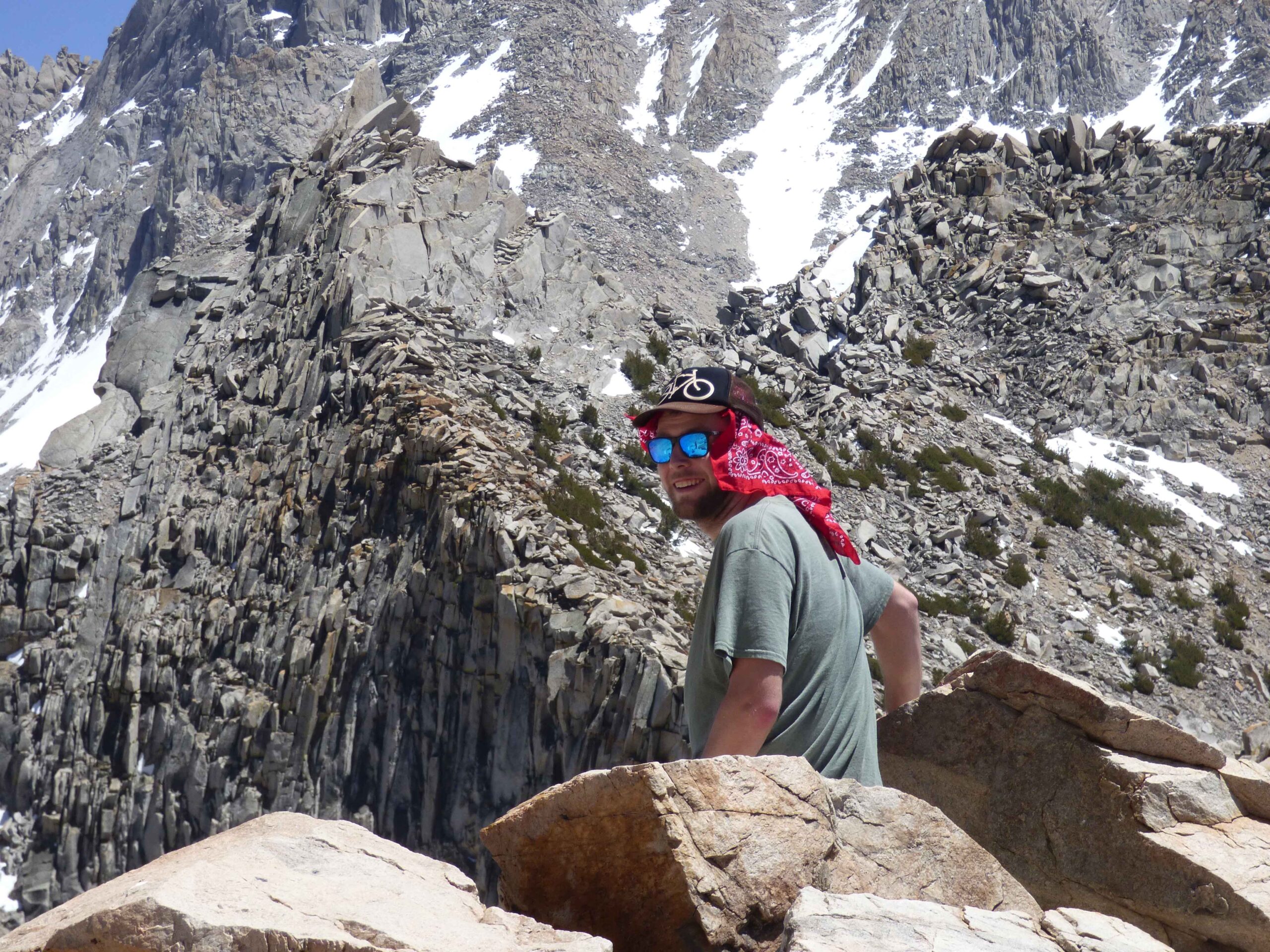 nick sitting down while on a hike