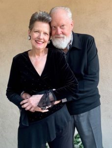 older couple posing while standing