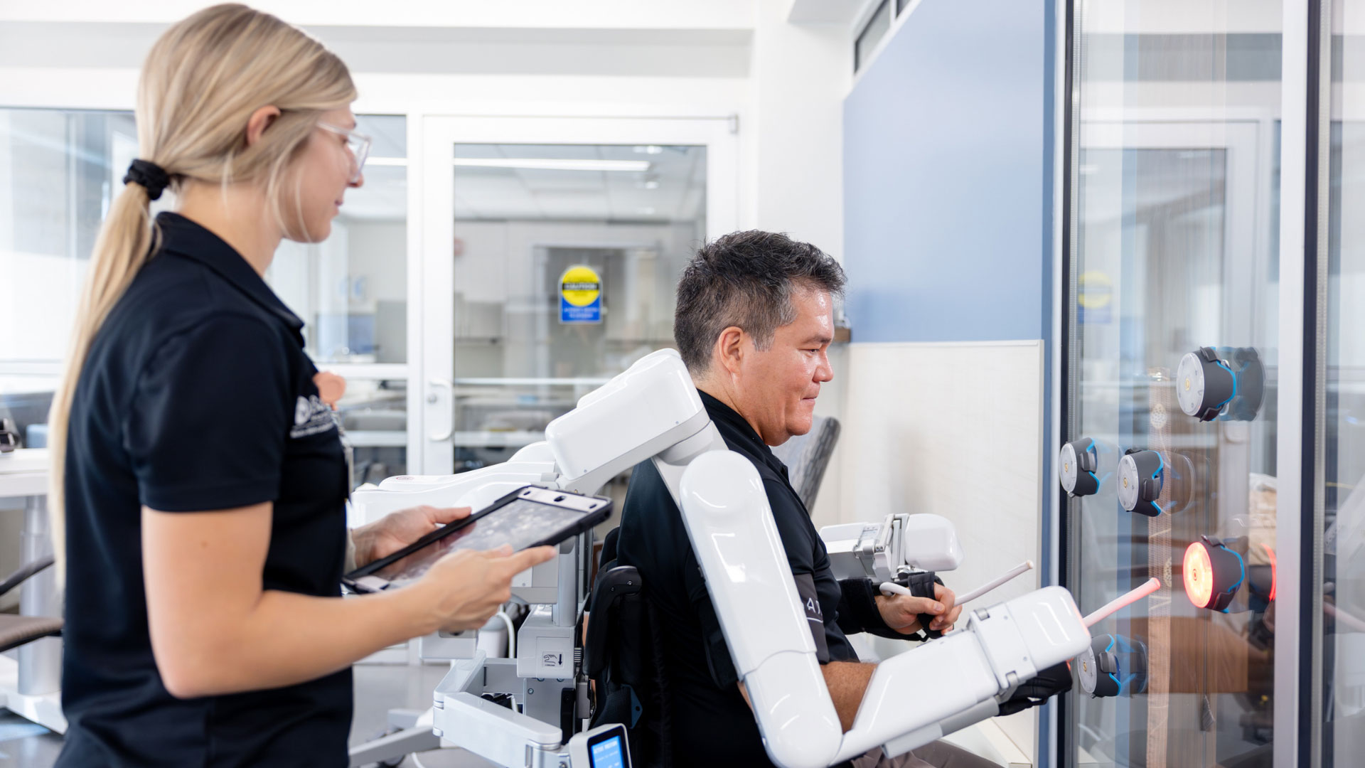 Barrow Neuro Therapist in the Neuro-Rehabilitation Gym with patient at Barrow Neurological Institute